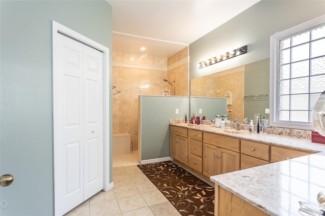 full bath featuring tile patterned floors, a closet, vanity, and walk in shower