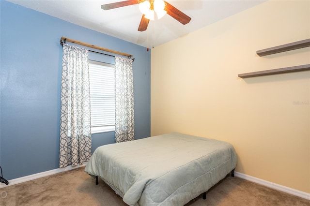 bedroom featuring carpet floors, ceiling fan, and baseboards