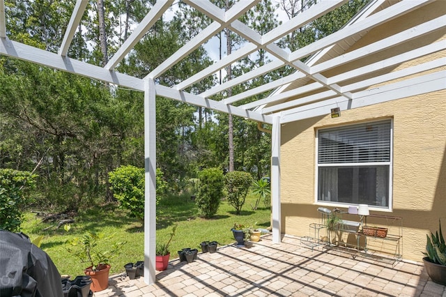 exterior space with area for grilling and a pergola