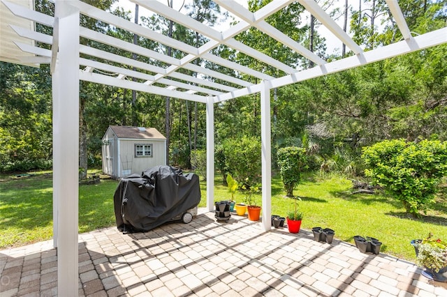 view of patio featuring a pergola, a grill, an outdoor structure, and a shed