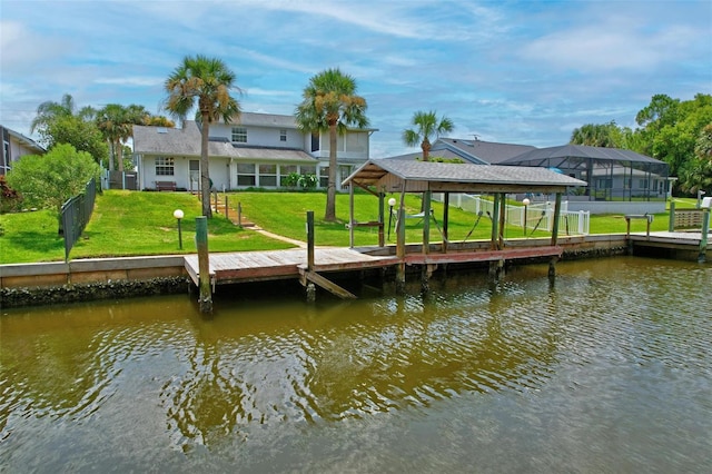 dock area featuring a yard and a water view