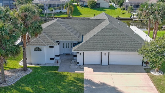 birds eye view of property with a water view