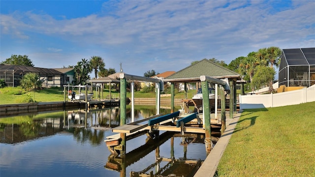 view of dock with a water view and a yard