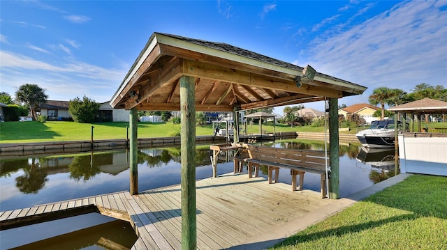 dock area featuring a water view and a yard