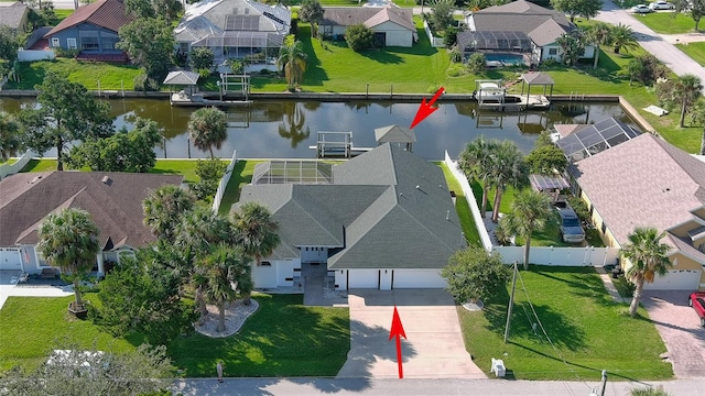 birds eye view of property featuring a water view