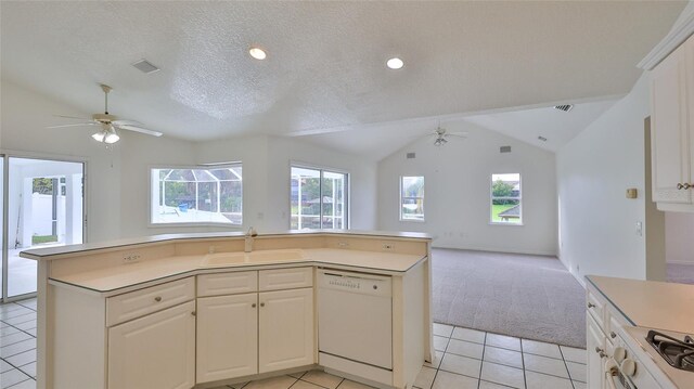 kitchen featuring a center island, dishwasher, white cabinets, and a textured ceiling