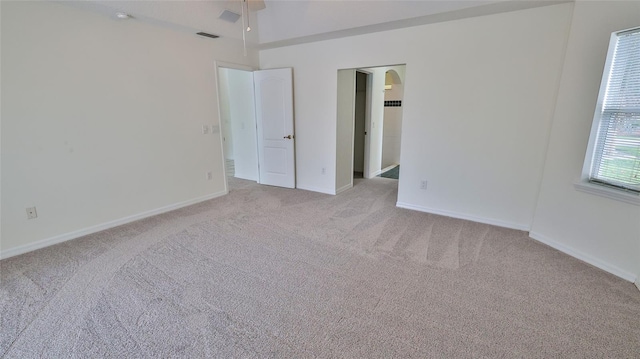 unfurnished bedroom with light carpet and ceiling fan