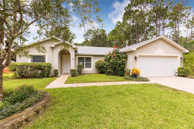 ranch-style house featuring a garage and a front yard