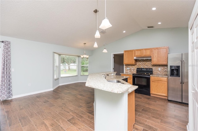 kitchen with under cabinet range hood, a sink, stainless steel fridge with ice dispenser, black electric range oven, and pendant lighting