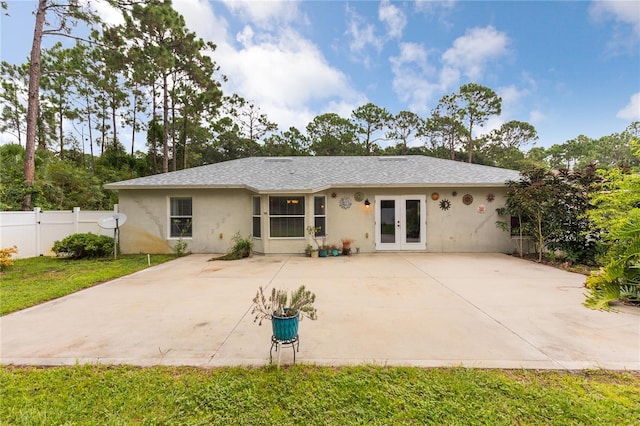 back of property featuring french doors