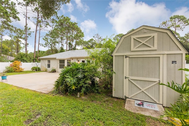 view of shed with fence