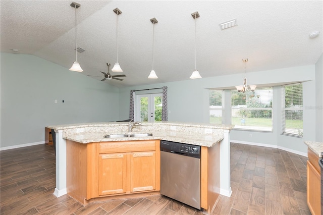 kitchen with visible vents, stainless steel dishwasher, a sink, an island with sink, and light stone countertops