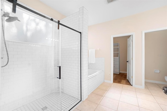 bathroom with separate shower and tub, tile patterned flooring, and toilet