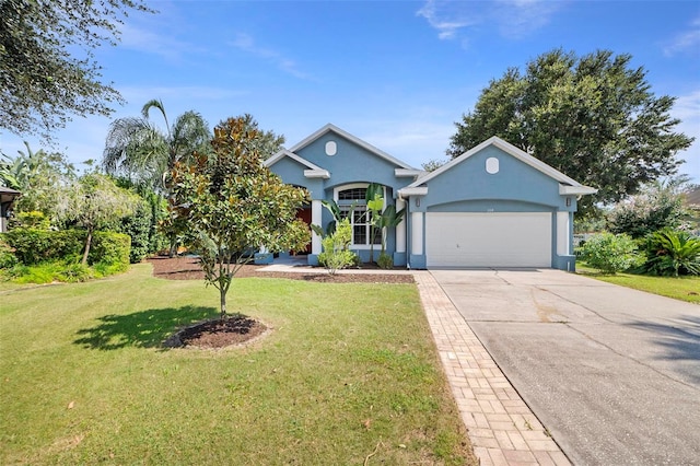 view of front of property with a garage and a front lawn