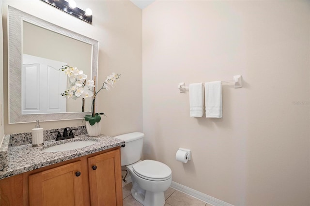 bathroom with tile patterned floors, vanity, and toilet