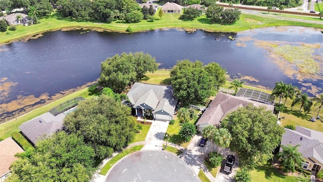 birds eye view of property with a water view