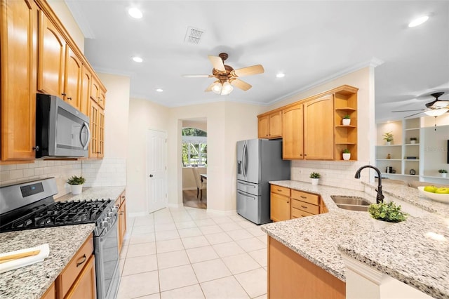 kitchen with backsplash, sink, ornamental molding, light stone counters, and stainless steel appliances