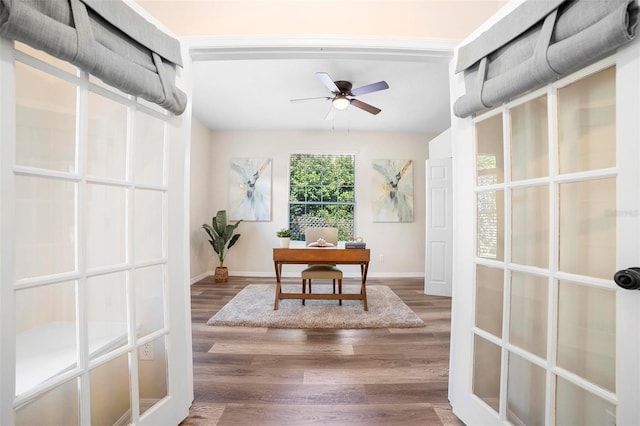 dining room with hardwood / wood-style flooring and ceiling fan