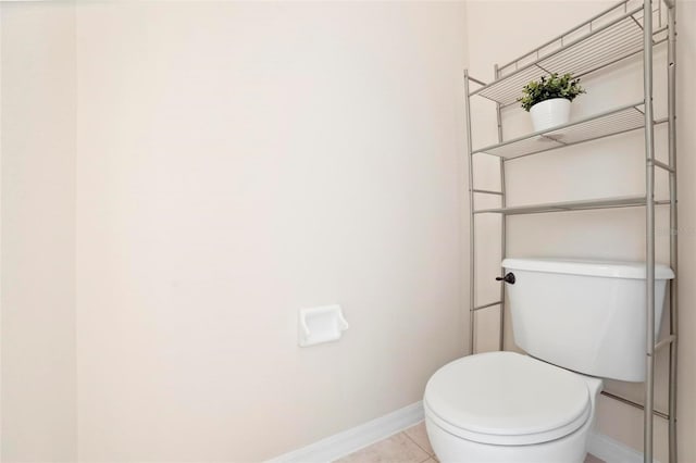 bathroom with tile patterned flooring and toilet