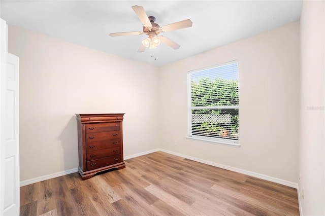 spare room with ceiling fan and light hardwood / wood-style floors