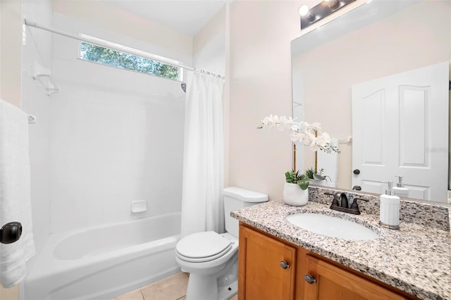 full bathroom featuring tile patterned floors, vanity, toilet, and shower / bath combo