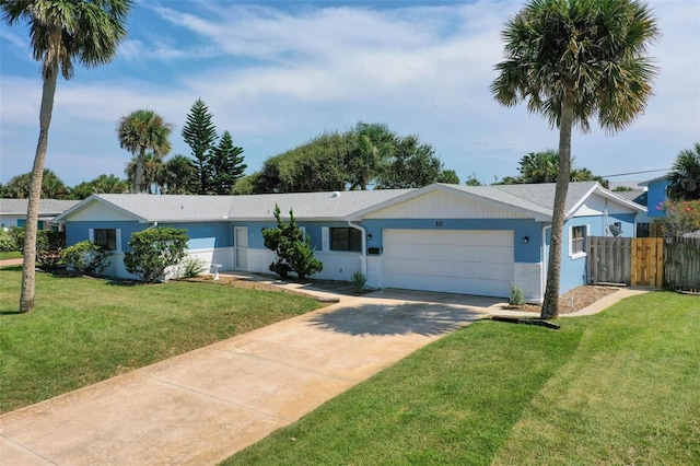 single story home featuring a garage and a front yard