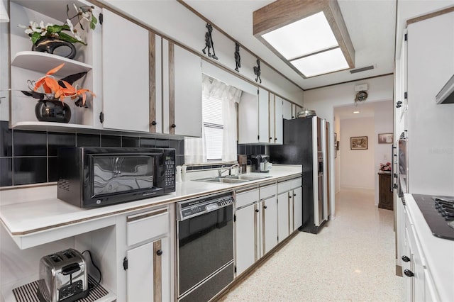 kitchen with visible vents, black appliances, open shelves, a sink, and light countertops