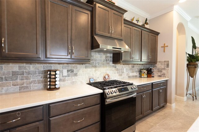 kitchen featuring tasteful backsplash, stainless steel gas stove, ornamental molding, and dark brown cabinets