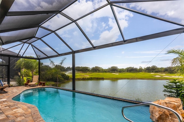 pool featuring a water view, a lanai, and a patio