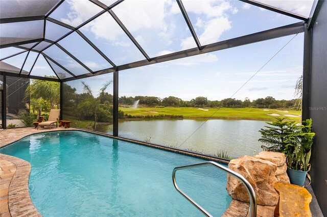 view of pool featuring a lanai and a water view