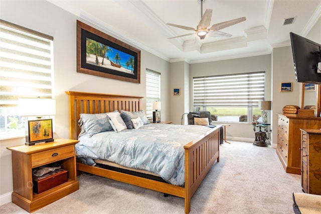 bedroom featuring ornamental molding, baseboards, a raised ceiling, visible vents, and light carpet