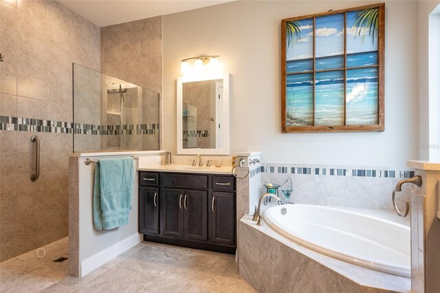 bathroom with tile patterned floors, separate shower and tub, and vanity