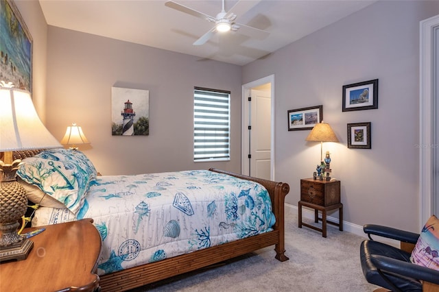 bedroom featuring baseboards, carpet floors, and a ceiling fan
