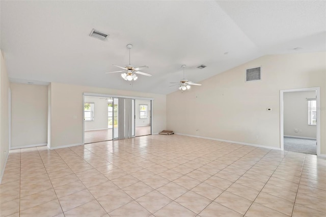 tiled spare room with ceiling fan and lofted ceiling