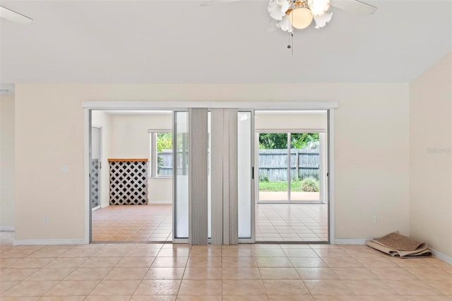 doorway to outside featuring plenty of natural light, ceiling fan, and light tile patterned floors