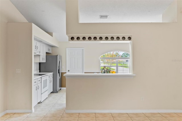 kitchen featuring white cabinetry, white range with electric stovetop, light tile patterned floors, and stainless steel fridge with ice dispenser