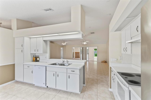 kitchen featuring white cabinetry, sink, light tile patterned floors, white appliances, and ceiling fan