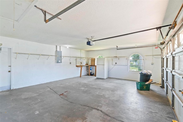 garage featuring a garage door opener, electric panel, and white refrigerator