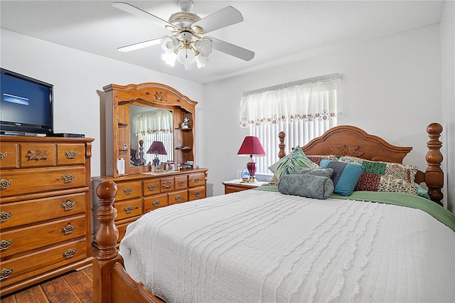 bedroom with hardwood / wood-style flooring and ceiling fan