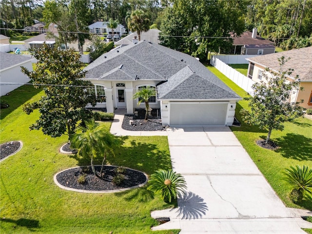 view of front facade featuring a garage and a front lawn