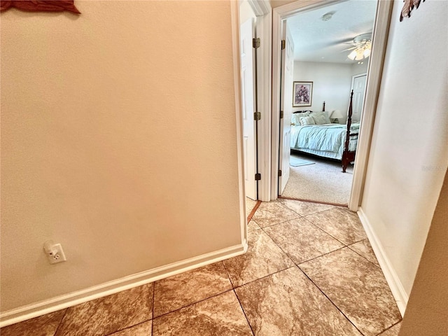 corridor featuring tile patterned floors