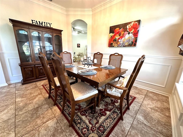 dining room featuring ceiling fan and ornamental molding