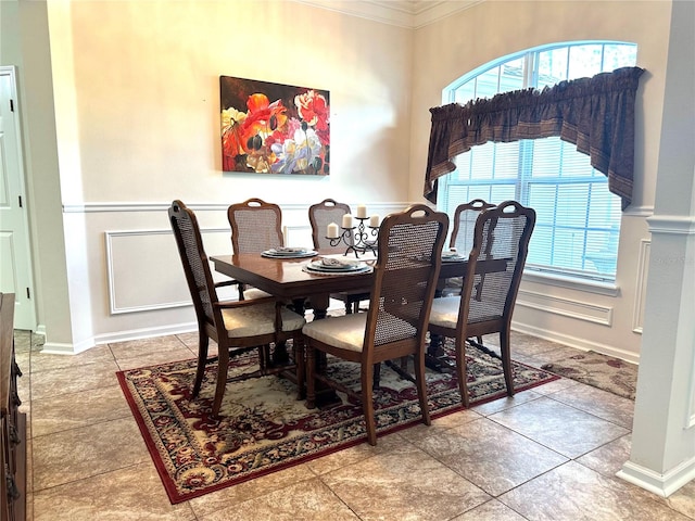 dining area featuring crown molding