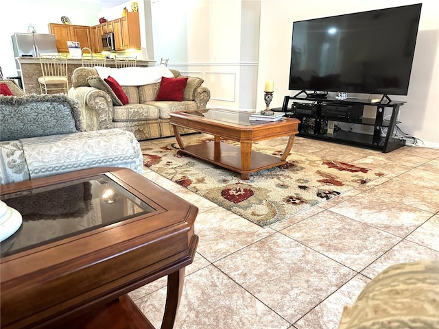 living room with light tile patterned floors