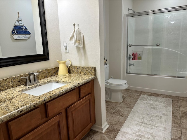 full bathroom featuring tile patterned flooring, toilet, vanity, and combined bath / shower with glass door