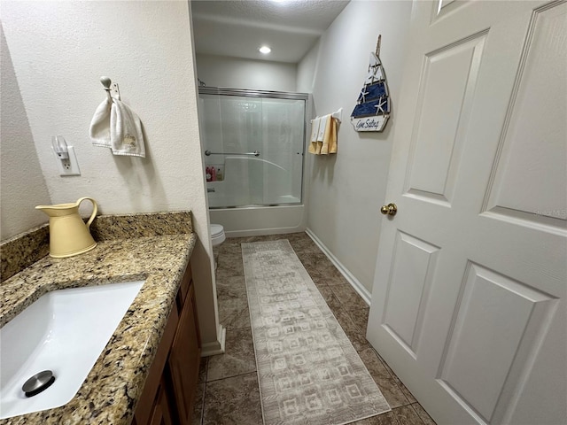 full bathroom featuring tile patterned floors, vanity, toilet, and enclosed tub / shower combo