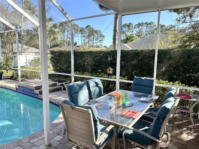 sunroom with a swimming pool