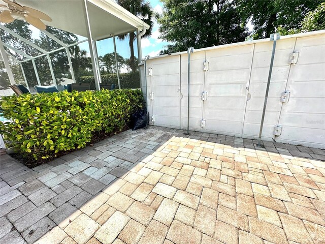 exterior space featuring ceiling fan