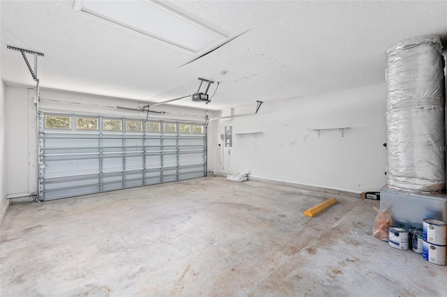 garage featuring a garage door opener and electric panel