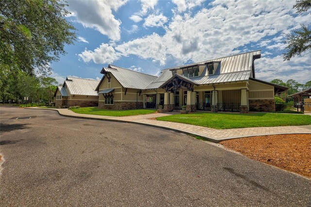 craftsman-style home with a front yard